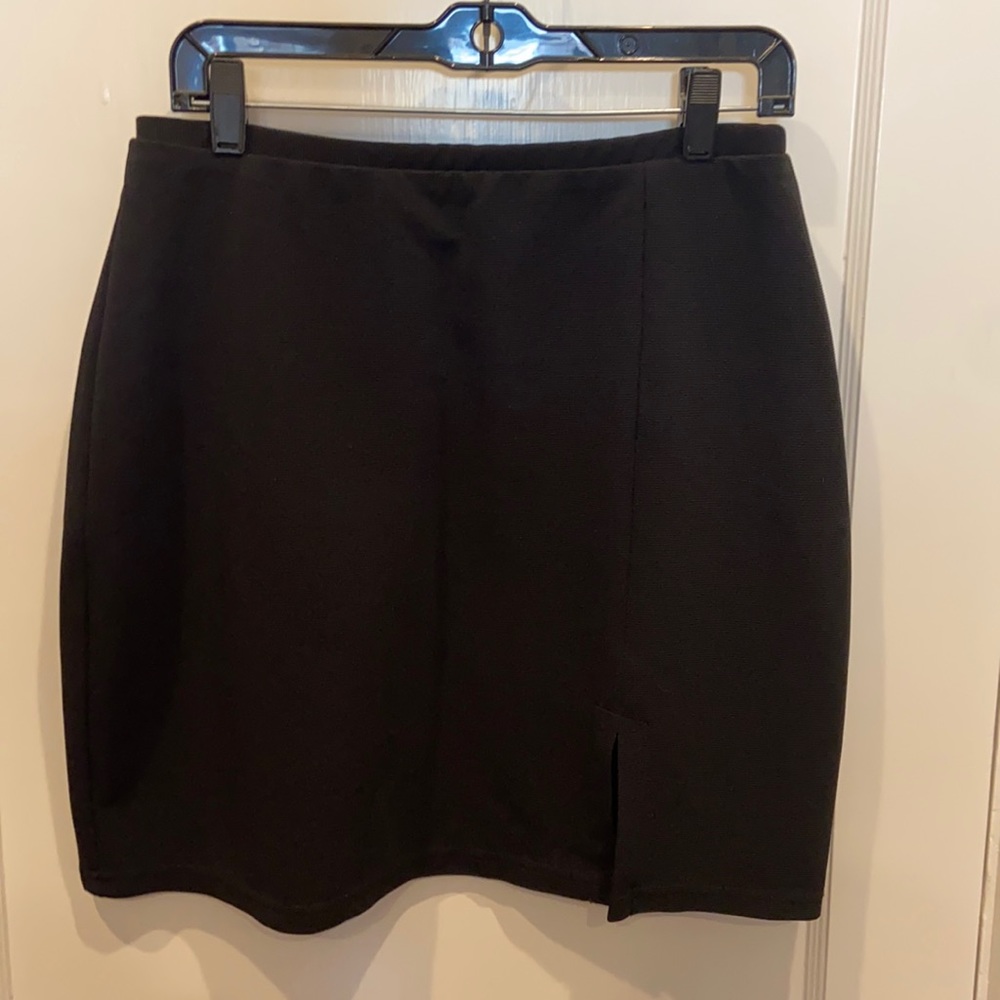 Lovely little black skirt with side slit in front